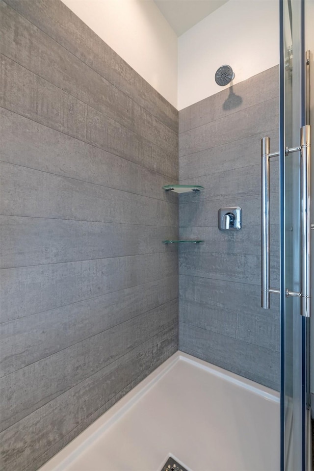 5498 Thimbleberry Loop, Helena, MT 59602 - bathroom featuring a tile shower