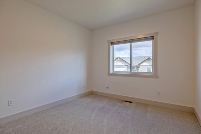 5498 Thimbleberry Loop, Helena, MT 59602 - unfurnished room with baseboards, visible vents, and light carpet