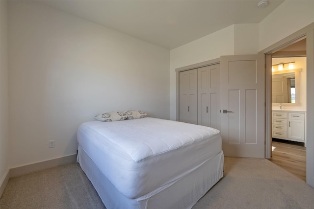 5498 Thimbleberry Loop, Helena, MT 59602 - bedroom featuring baseboards, light carpet, and a closet