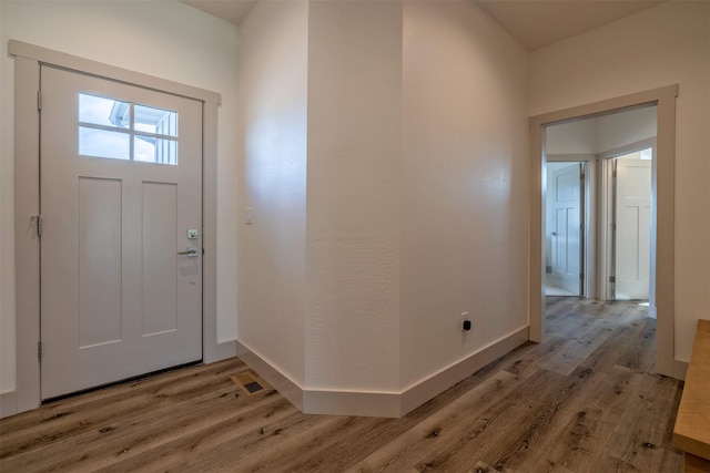 5498 Thimbleberry Loop, Helena, MT 59602 - entryway featuring baseboards, light wood-style flooring, and visible vents