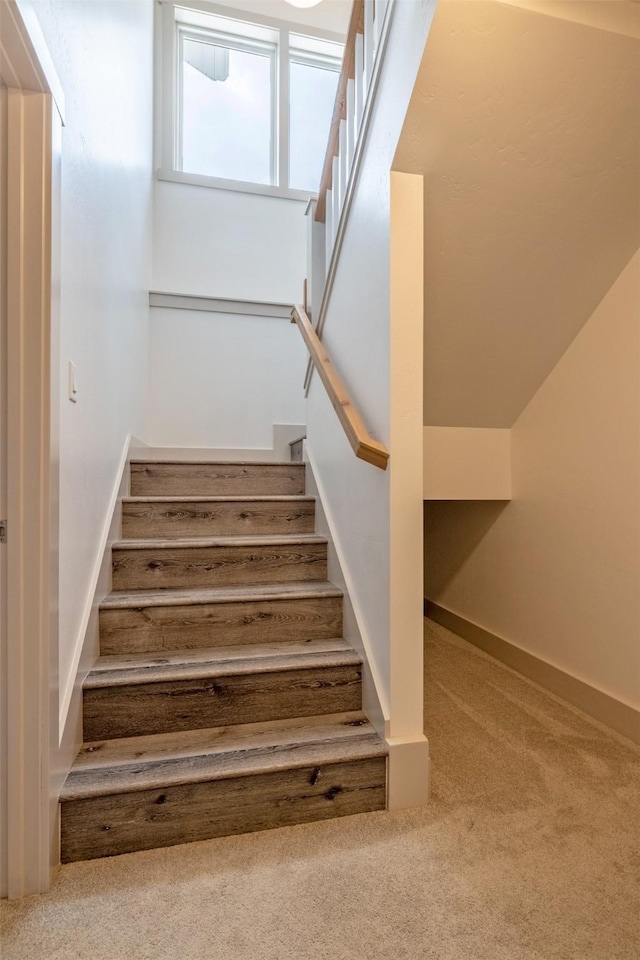 5498 Thimbleberry Loop, Helena, MT 59602 - stairway featuring baseboards and carpet