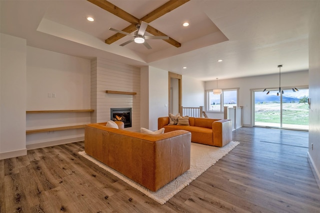 5498 Thimbleberry Loop, Helena, MT 59602 - living area with recessed lighting, ceiling fan, wood finished floors, and a large fireplace