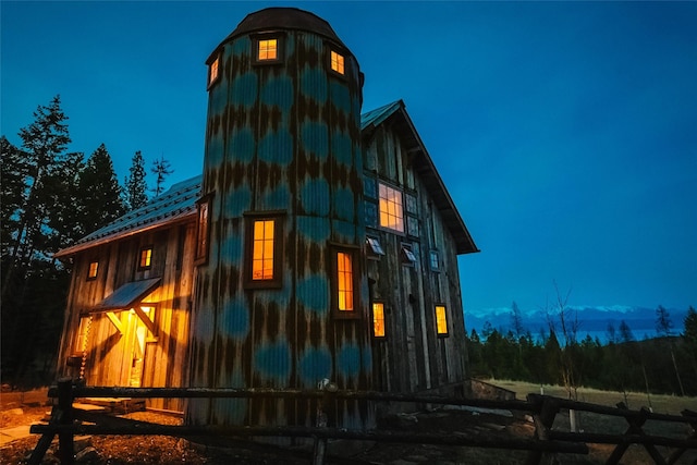 view of side of property with a barn