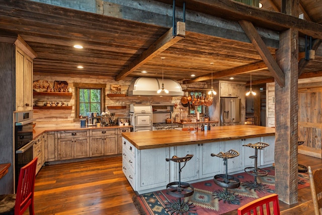 kitchen featuring open shelves, dark wood finished floors, beam ceiling, high end refrigerator, and wood counters