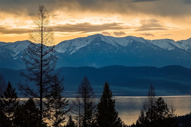 mountain view featuring a water view