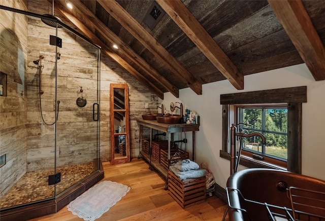 living room with wooden walls, wood ceiling, lofted ceiling with beams, and wood finished floors