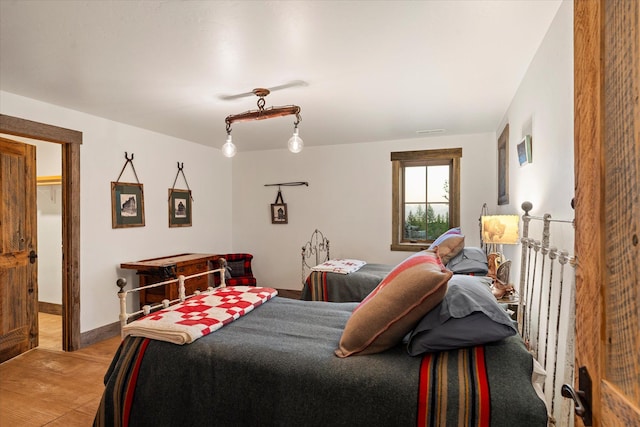 bedroom featuring visible vents and light wood-style flooring