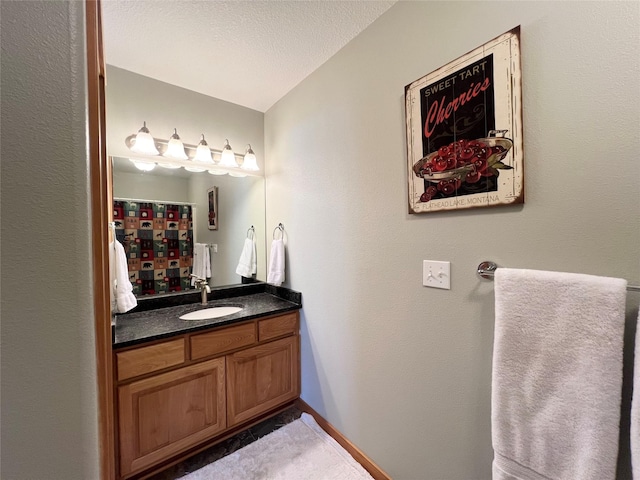 107 Crescent Lndg, Polson, MT 59860 - bathroom featuring vanity, baseboards, and a shower with curtain