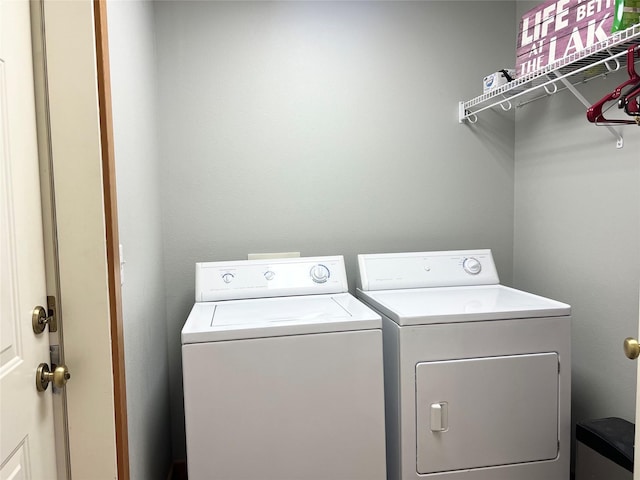107 Crescent Lndg, Polson, MT 59860 - clothes washing area featuring independent washer and dryer and laundry area