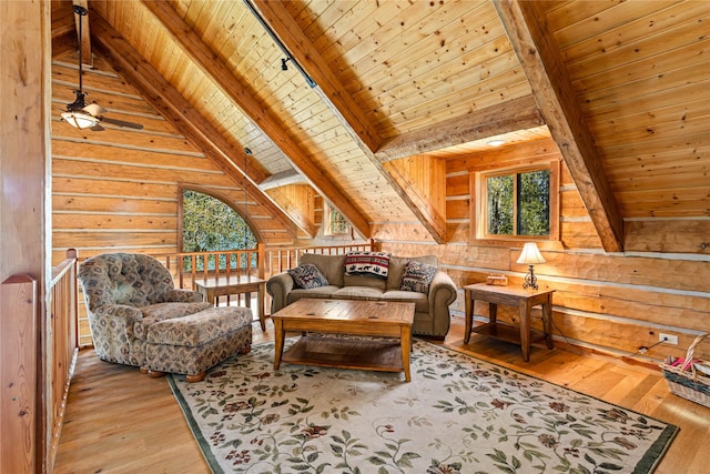 sitting room featuring wooden walls, wooden ceiling, vaulted ceiling with beams, and hardwood / wood-style flooring