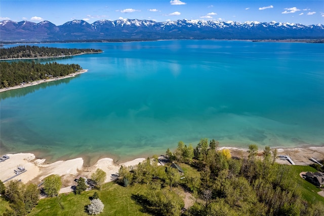 drone / aerial view with a water and mountain view
