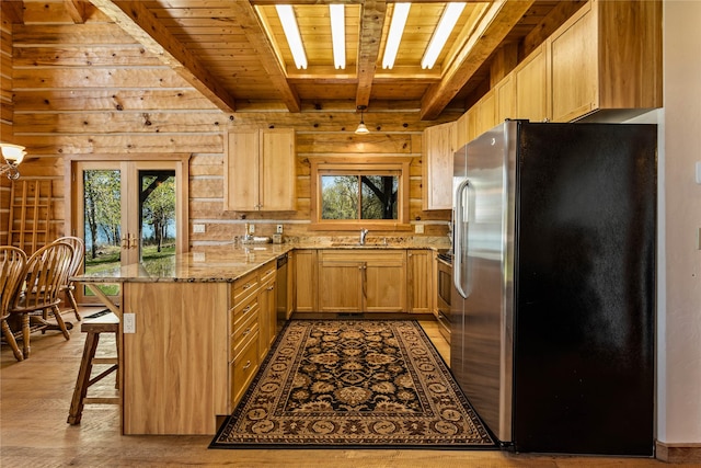 kitchen featuring wood ceiling, light brown cabinetry, beam ceiling, a sink, and stainless steel fridge with ice dispenser