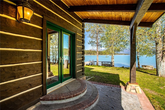 view of patio / terrace featuring a water view and french doors