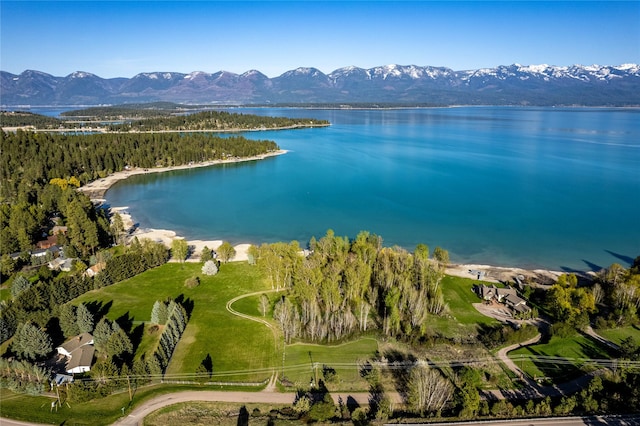 aerial view featuring a water and mountain view