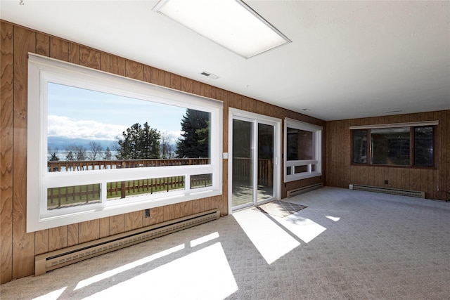 unfurnished sunroom with visible vents and baseboard heating