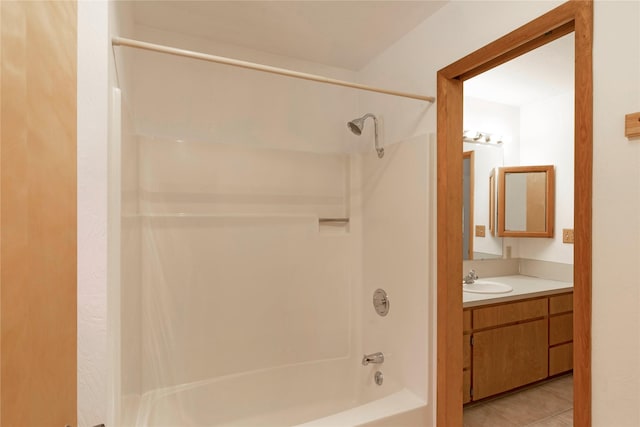 bathroom with shower / bath combination, vanity, and tile patterned flooring