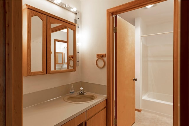 full bath featuring vanity, shower / bathing tub combination, and tile patterned floors