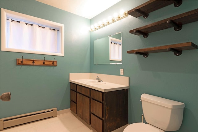 bathroom with vanity, toilet, and a baseboard radiator