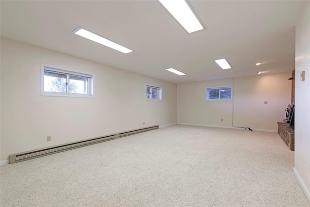 spare room with baseboards and a baseboard radiator