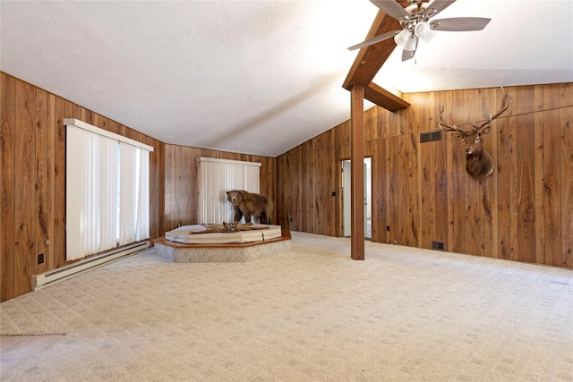 unfurnished living room with wooden walls, lofted ceiling with beams, carpet, and a baseboard radiator