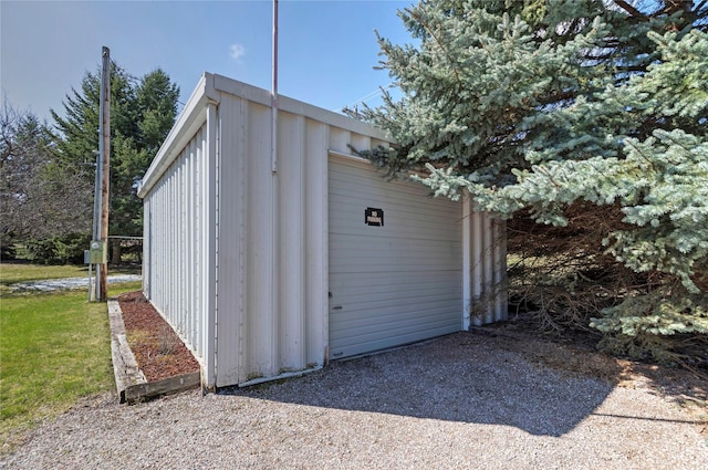 view of outbuilding featuring an outdoor structure and a garage