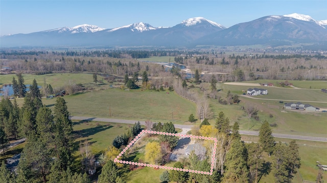 drone / aerial view with a mountain view and a rural view