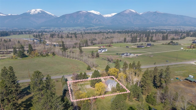drone / aerial view featuring a rural view and a mountain view