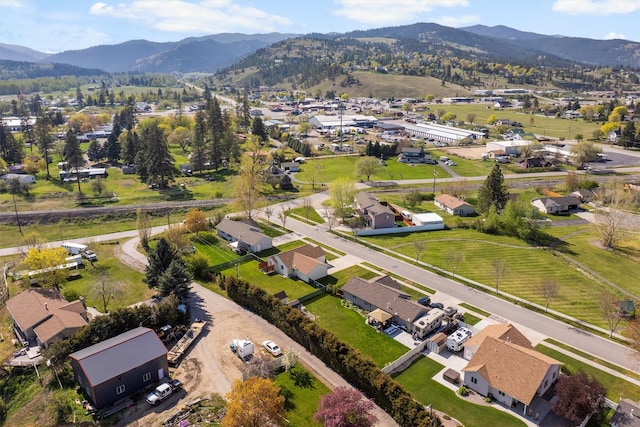 drone / aerial view featuring a residential view and a mountain view