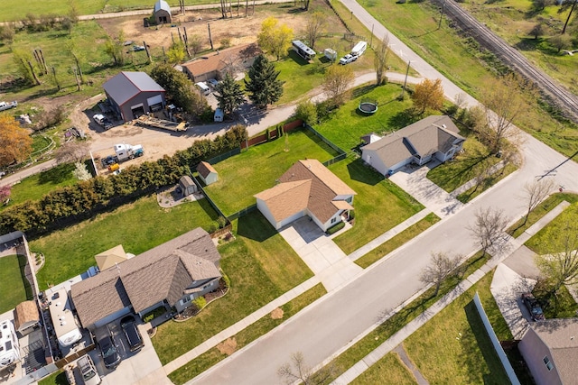 birds eye view of property with a residential view
