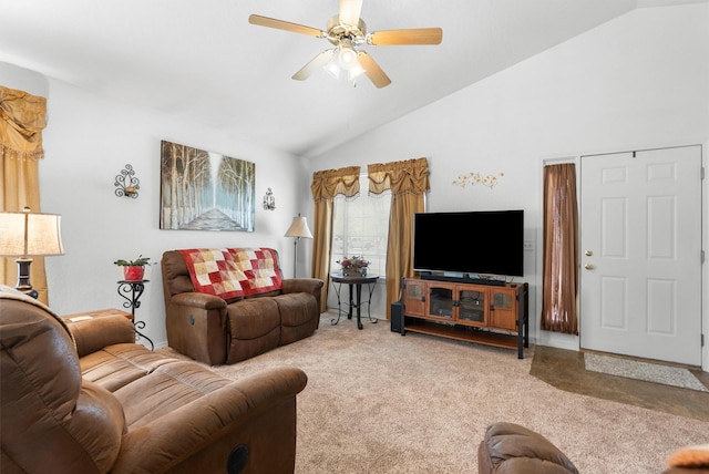 living room featuring carpet floors, ceiling fan, and vaulted ceiling