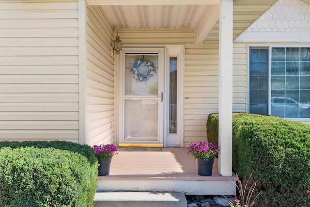 doorway to property featuring covered porch
