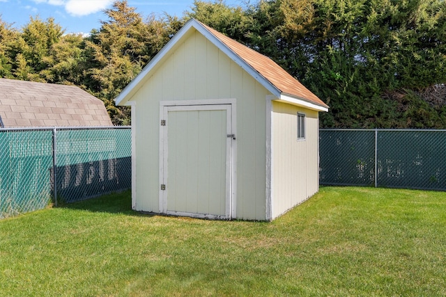 view of shed featuring fence