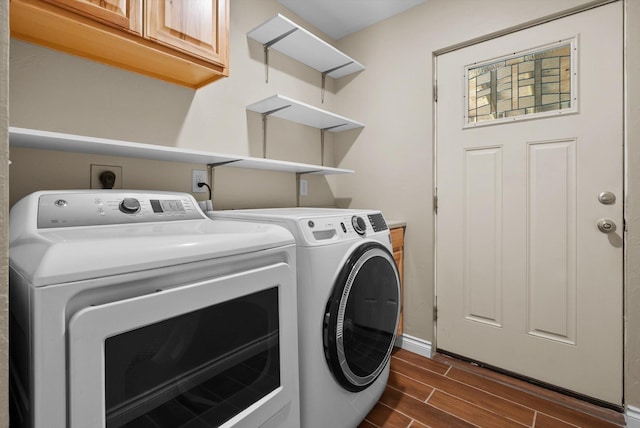 100 Dawson Trl, Kalispell, MT 59901 - washroom with independent washer and dryer, dark wood-style flooring, and cabinet space