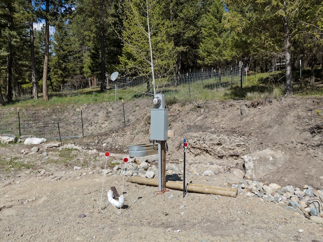 exterior details with fence and electric meter