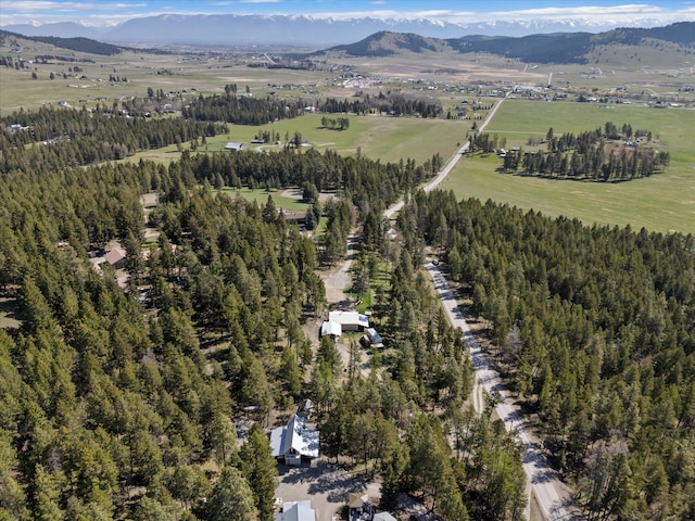 drone / aerial view with a mountain view and a rural view