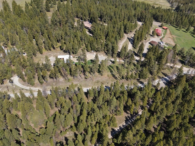 drone / aerial view featuring a view of trees