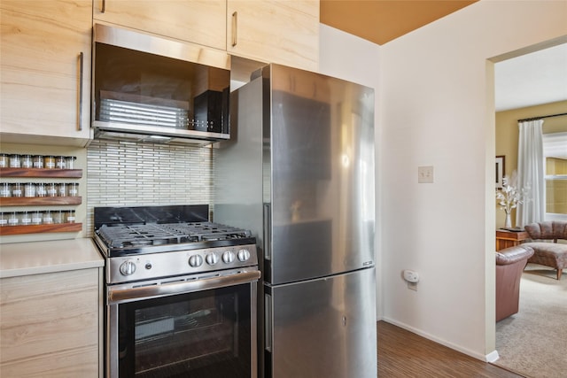 1702 Bancroft St, Missoula, MT 59801 - kitchen featuring baseboards, light countertops, wood finished floors, and stainless steel appliances