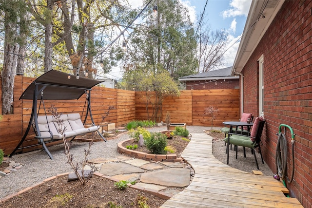 1702 Bancroft St, Missoula, MT 59801 - view of yard with a fenced backyard, a patio area, and a wooden deck