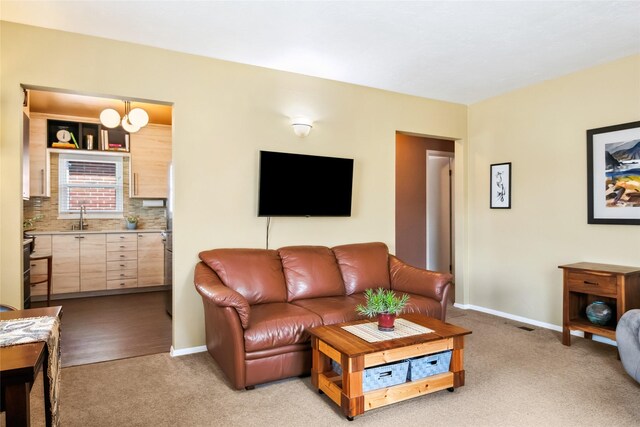 1702 Bancroft St, Missoula, MT 59801 - living room featuring baseboards and light colored carpet
