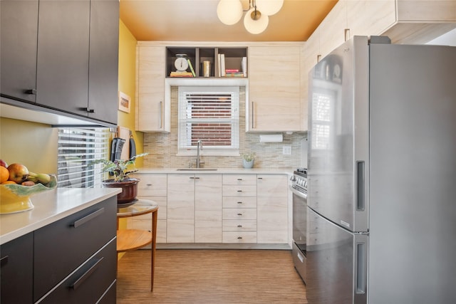 1702 Bancroft St, Missoula, MT 59801 - kitchen with light countertops, a sink, decorative backsplash, and stainless steel appliances