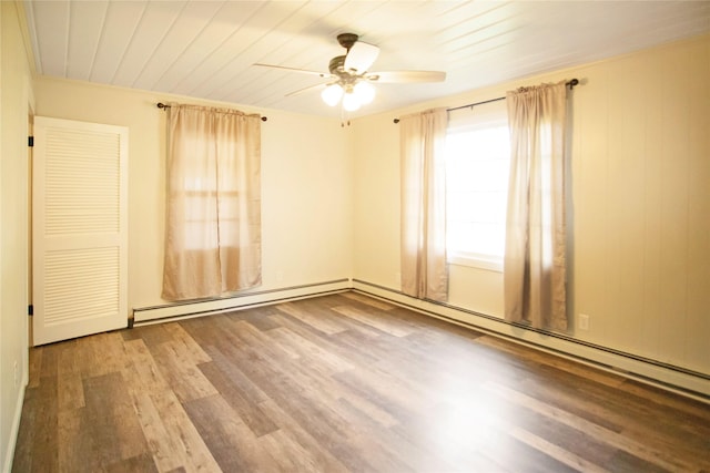 330 Bowman Rd, Hamilton, MT 59840 - spare room with a ceiling fan, wood finished floors, a baseboard radiator, and wooden ceiling