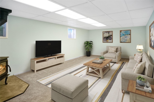 330 Bowman Rd, Hamilton, MT 59840 - living area featuring a wood stove, a drop ceiling, and light carpet