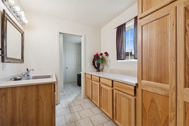 1020 3rd Ave E, Columbia Falls, MT 59912 - bathroom with tile patterned floors and vanity