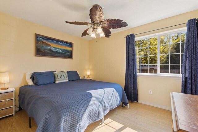 1020 3rd Ave E, Columbia Falls, MT 59912 - bedroom featuring baseboards, a ceiling fan, and wood finished floors