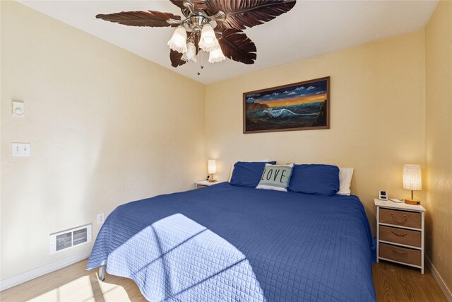 1020 3rd Ave E, Columbia Falls, MT 59912 - bedroom with visible vents, baseboards, ceiling fan, and wood finished floors