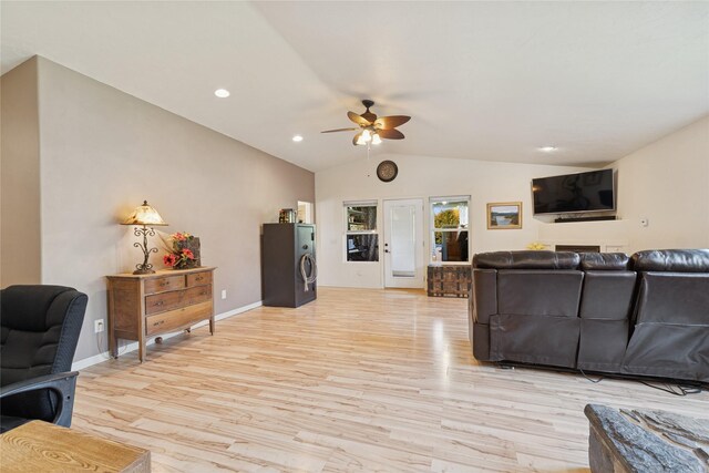 1020 3rd Ave E, Columbia Falls, MT 59912 - living room featuring light wood-style floors, baseboards, ceiling fan, and lofted ceiling