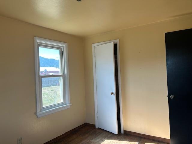 2421 Clark St, Victor, MT 59875 - unfurnished bedroom with dark wood finished floors