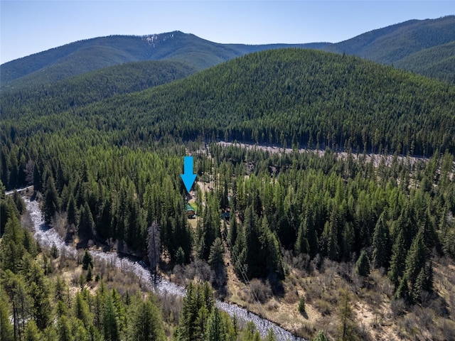mountain view with a wooded view