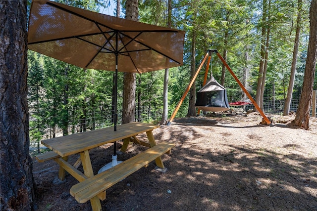 view of patio / terrace with a view of trees
