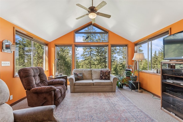 sunroom / solarium featuring carpet floors, plenty of natural light, and lofted ceiling